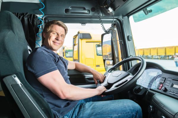 driver in the cab of a truck