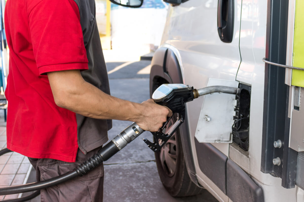 man refueling a vehicle