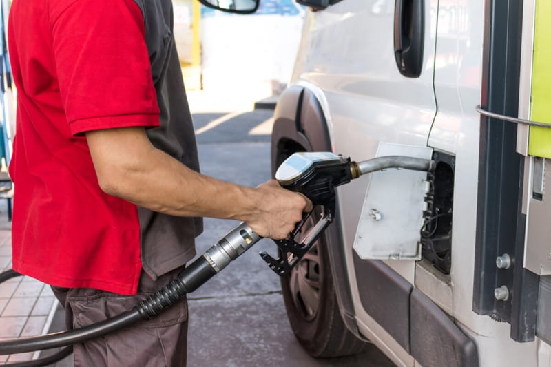 man refueling a vehicle