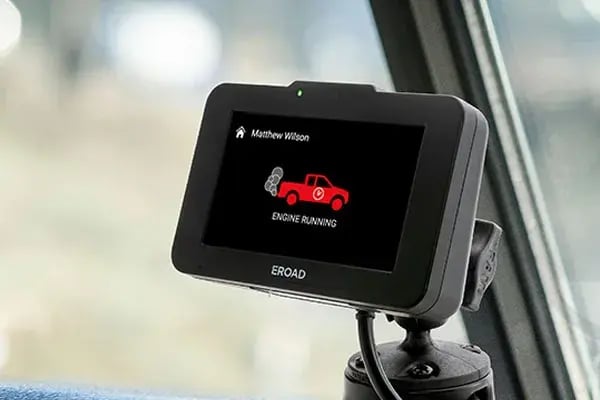 EROAD Ehubo2 in-cab device showing an engine running alert to the driver