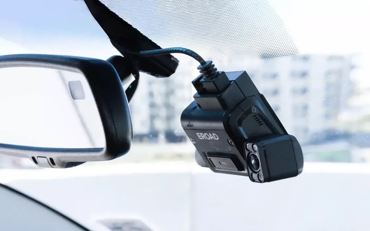 An EROAD Clarity dashcam mounted on the windscreen beside the rear-view mirror