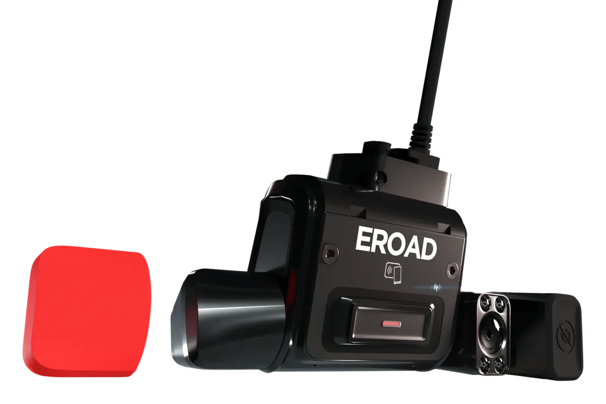 The EROAD Clarity unit with its road and driver-facing cameras uncovered and the tap-to-log-in symbol on the front