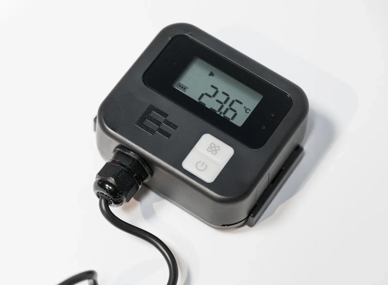 A CoreHub temperature sensor with its display reading 23.6 °C