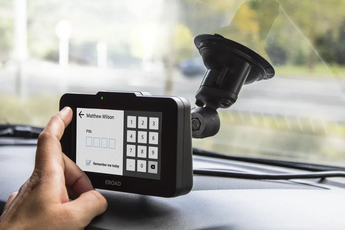 A driver enters a PIN to log in on an Ehubo2 mounted on the windscreen