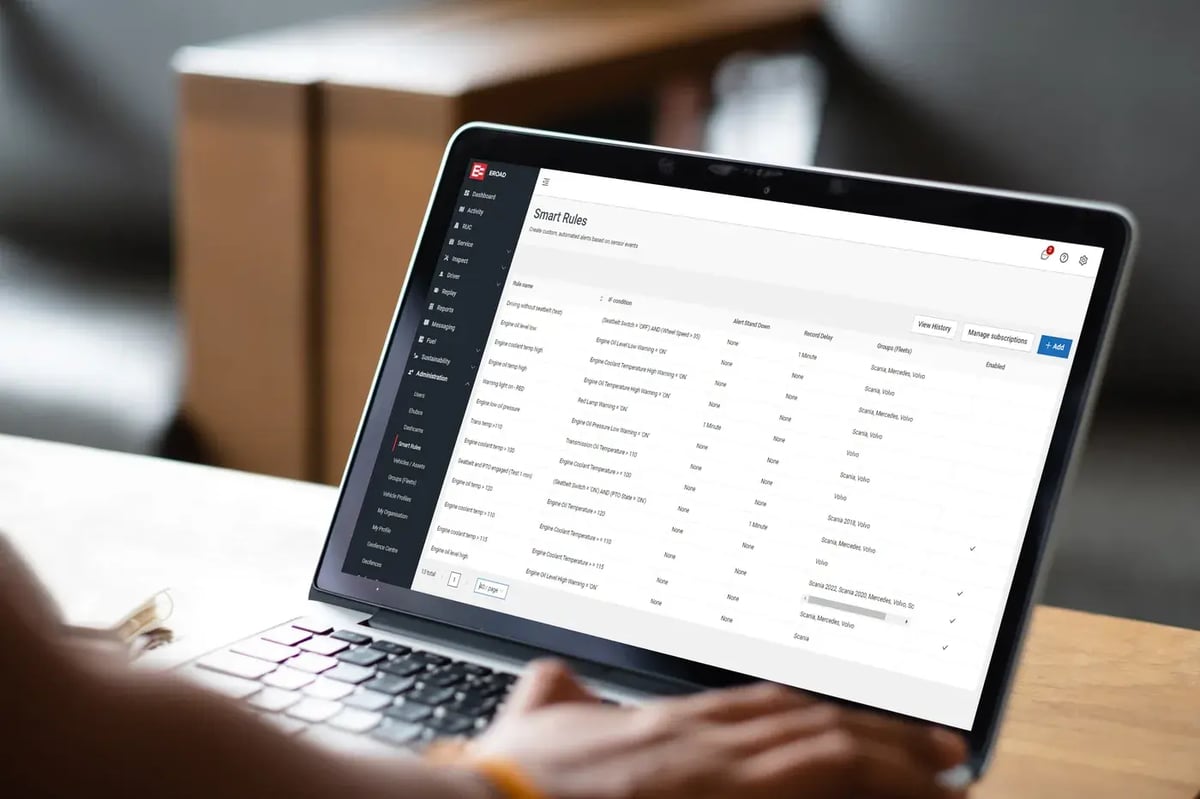 MyEROAD Smart Rules screen listing engine alerts such as low oil level and high coolant temperature, on a laptop
