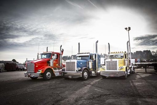 Three tractor trailers side by side
