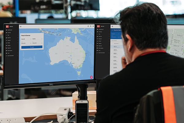 Operator viewing the Proof of Service screen in MyEROAD across two monitors
