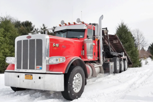 red Silvarole Trucking semi truck in the snow