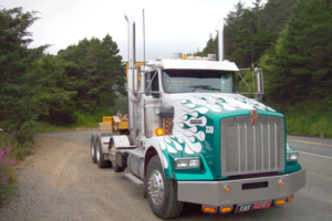 Crestline Construction white semi truck with green flame paint job