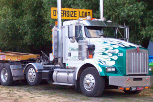 Crestline Construction truck with oversize load sign