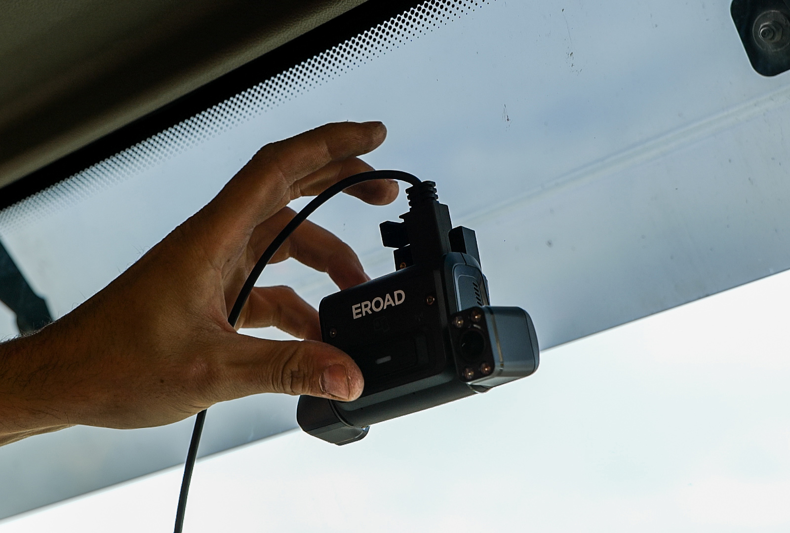 Driver Adjusting EROAD Clarity Get Dashcam